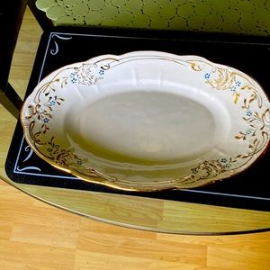 Elegant platter and gravy boat set.  Gold edgings
